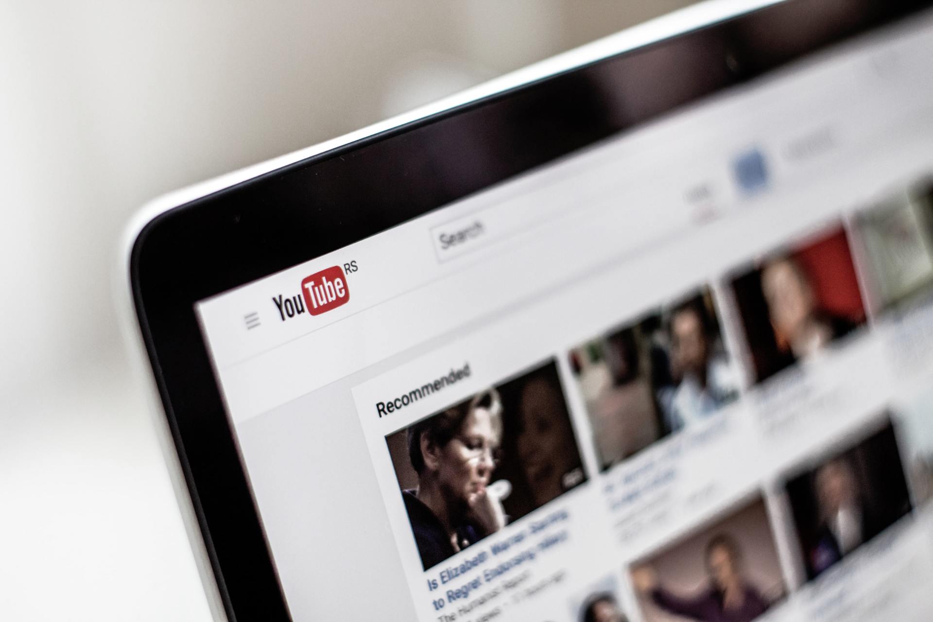 a close up of a laptop screen displaying a youtube page .