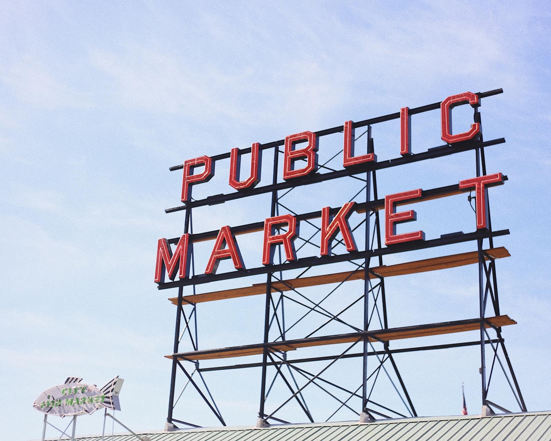 A sign that says public market on top of a building
