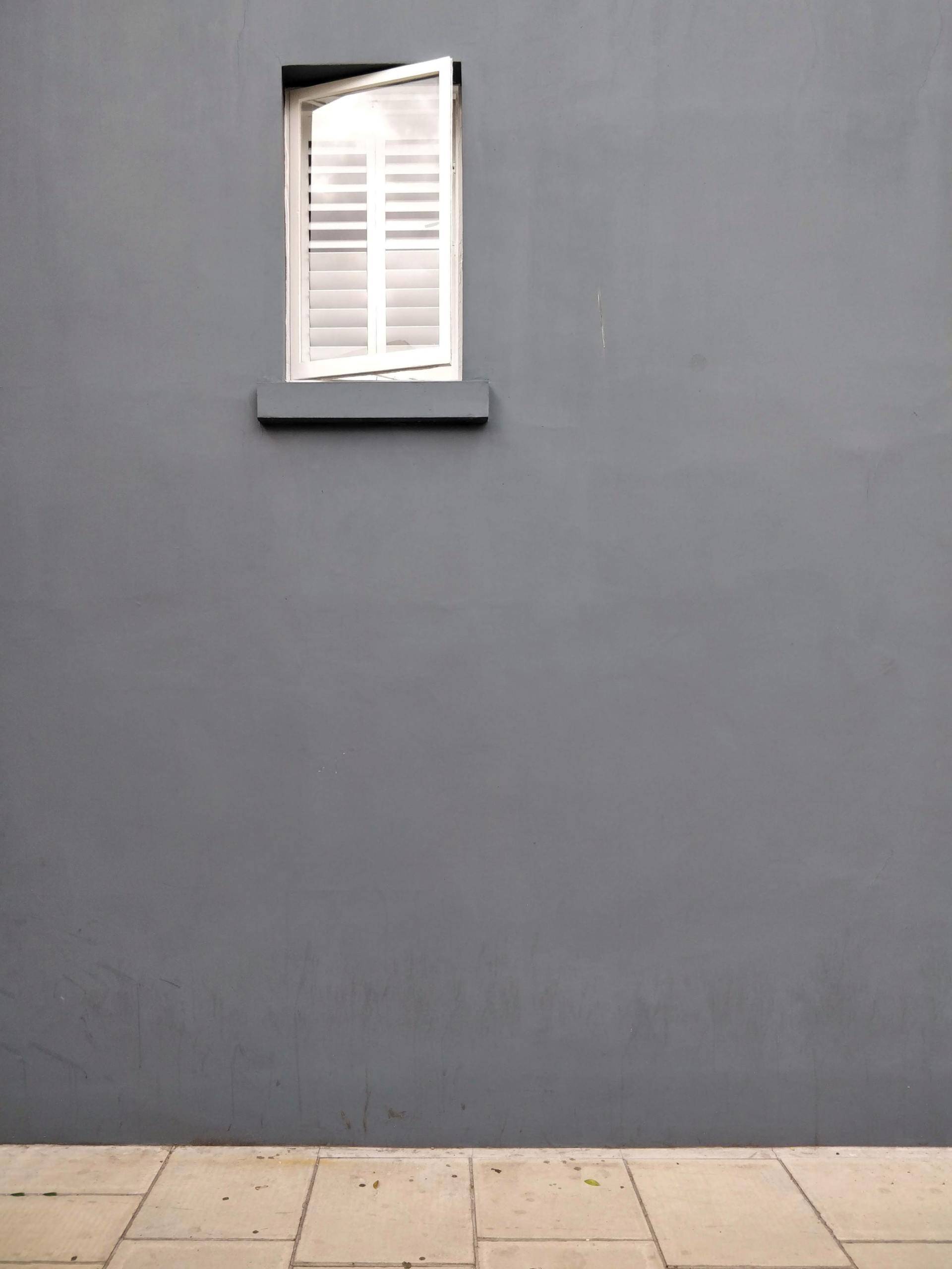 Picture of a grey rendered house newly painted by Painters and Decorators Derby