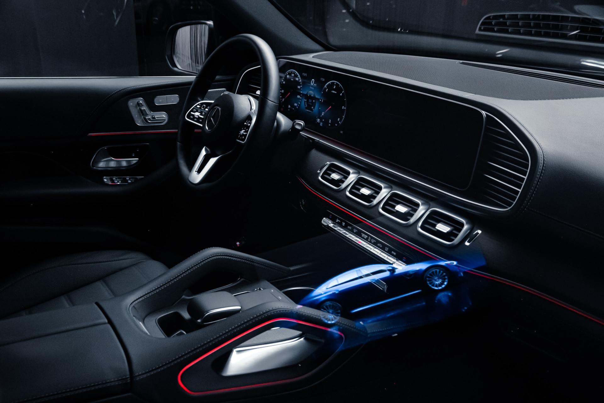 A close up of the interior of a car with a steering wheel and dashboard.