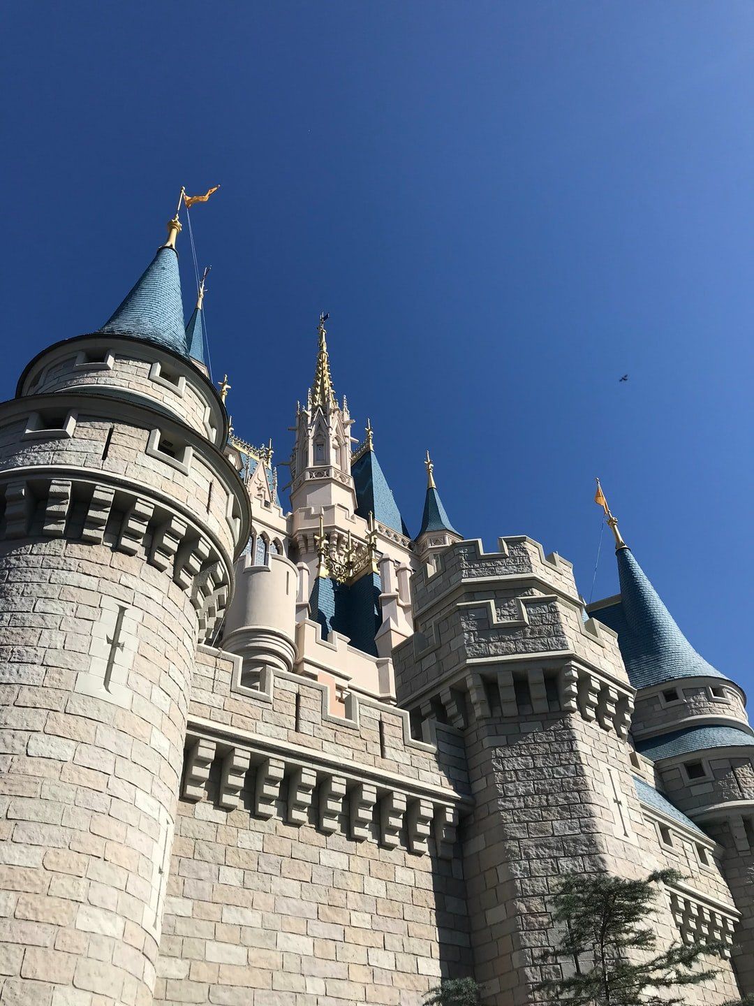A large castle with a blue sky in the background.