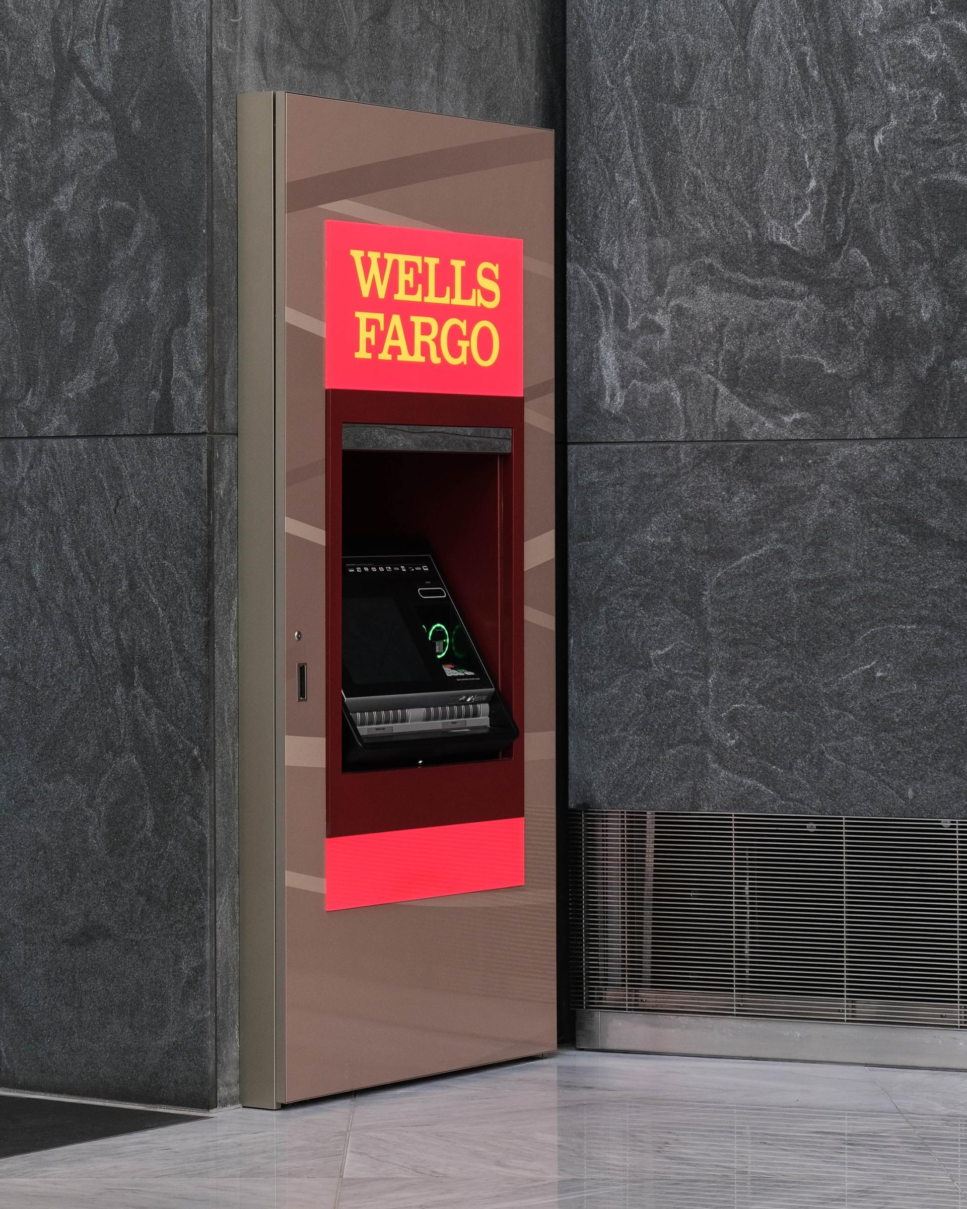 A wells fargo atm machine on the side of a building