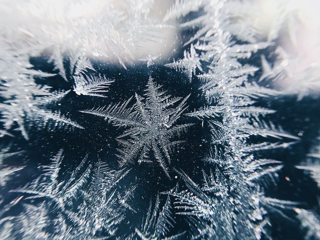A close-up of ice crystals on a window.