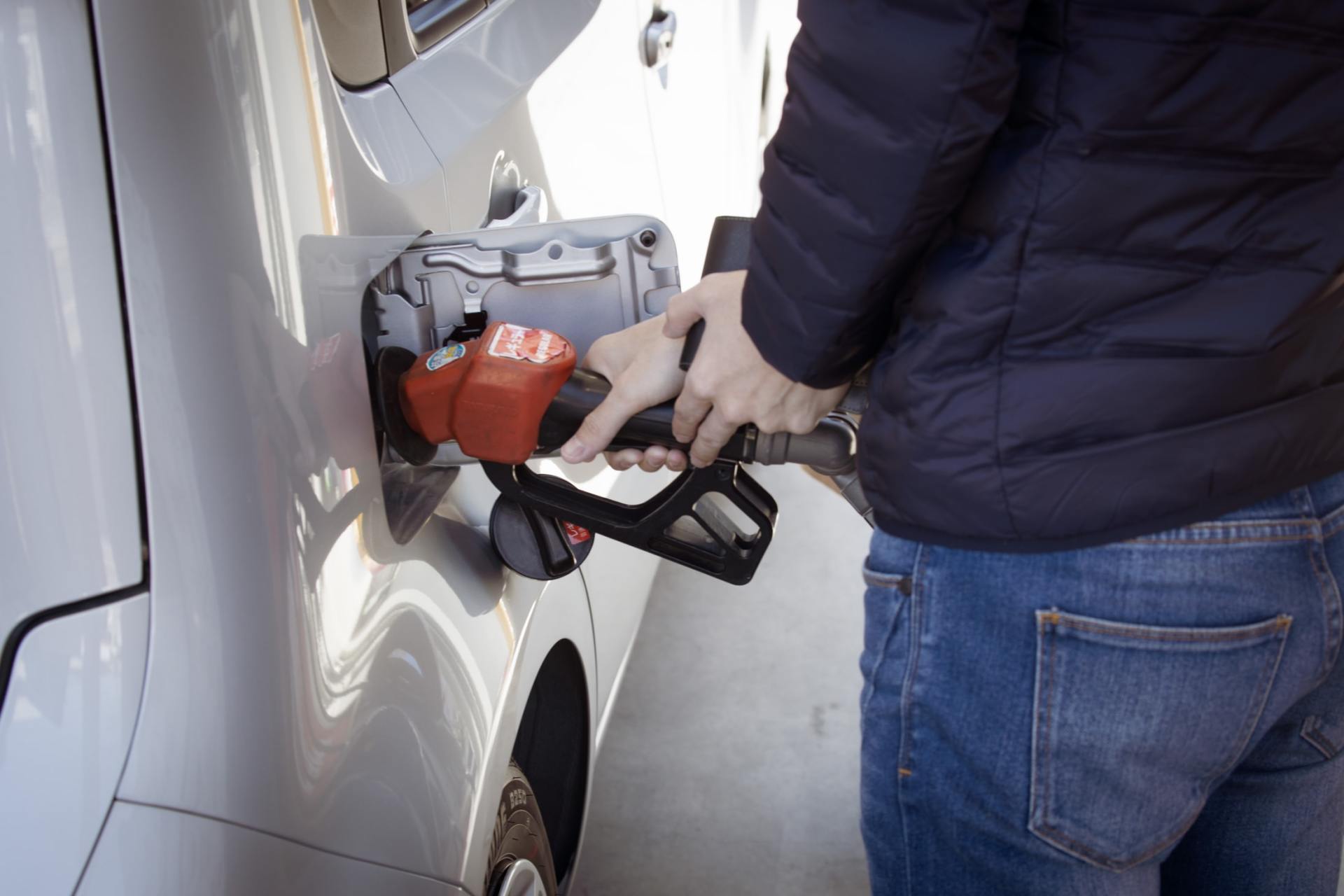 filling gas tank of car