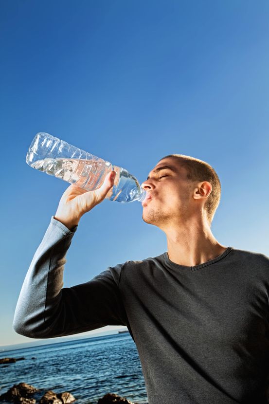 Man Drinking Clear Water— Hinterland Water Cartage in Hinterland, QLD