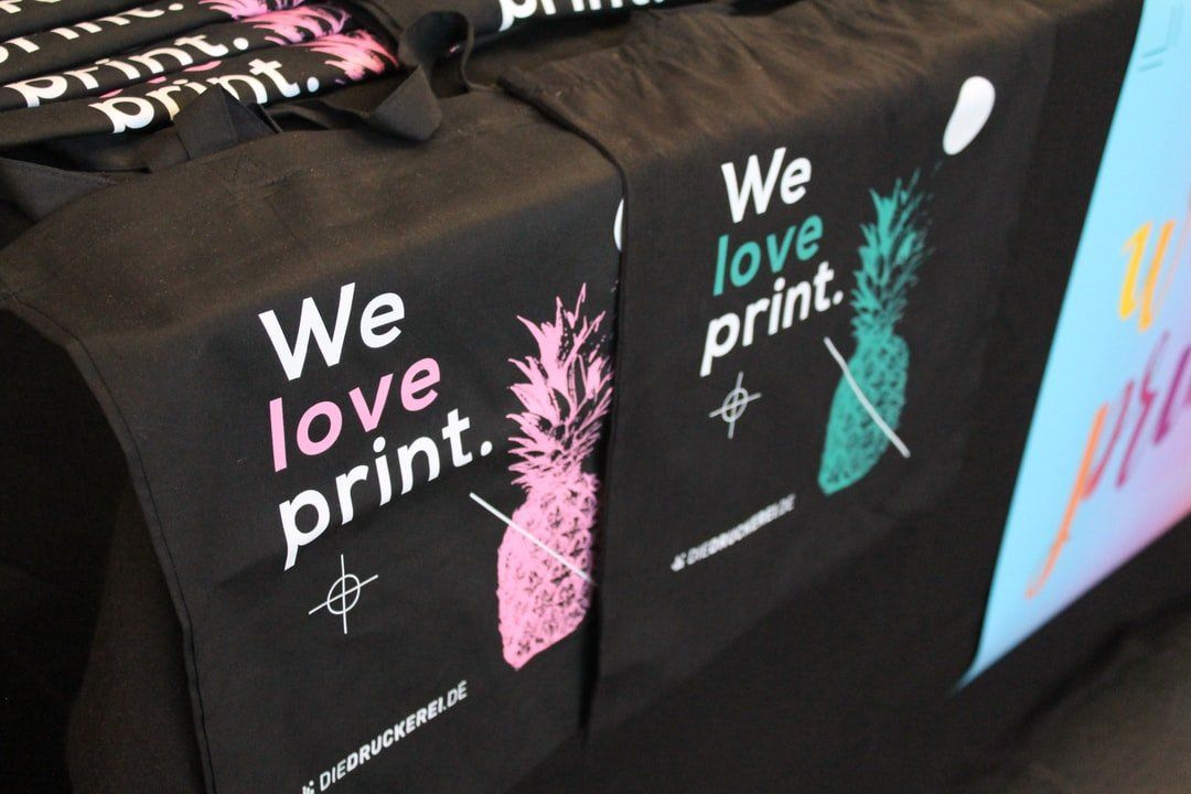 A table with a table runner that says we love print