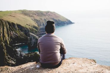 man looking out to sea