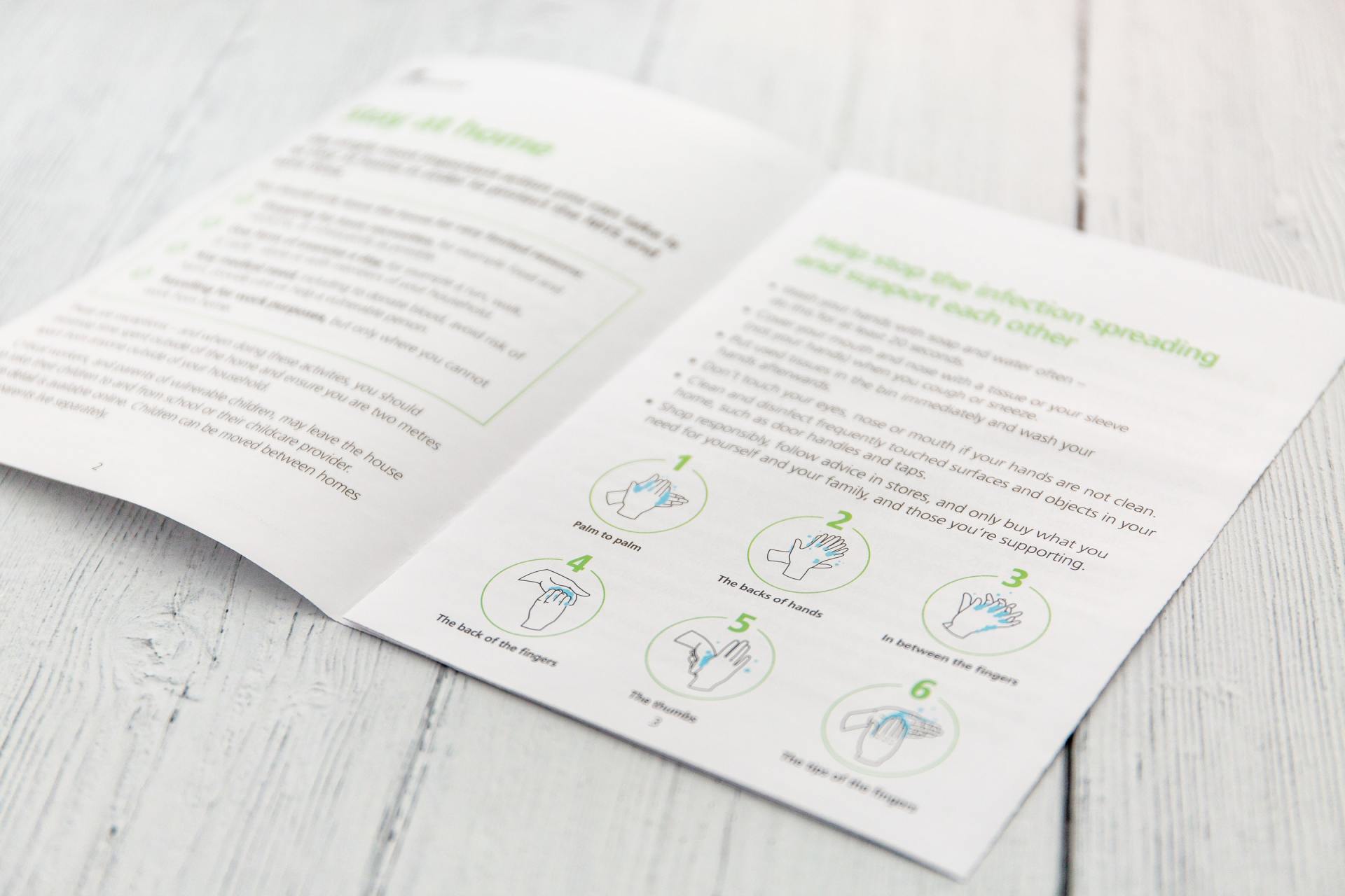 A book is open to a page with instructions on how to wash your hands.