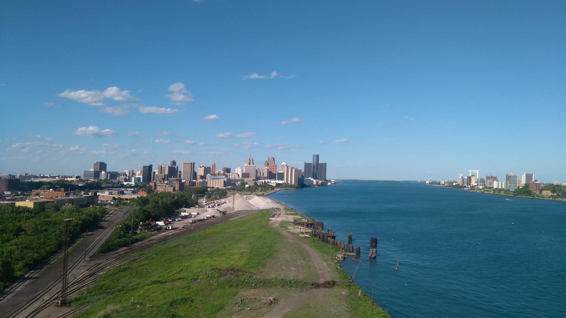 An aerial view of a large body of water with a city in the background.