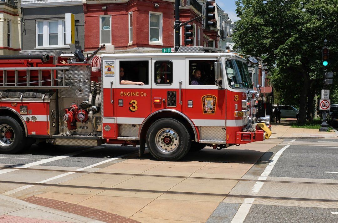 A red and white fire truck with the number 3 on it