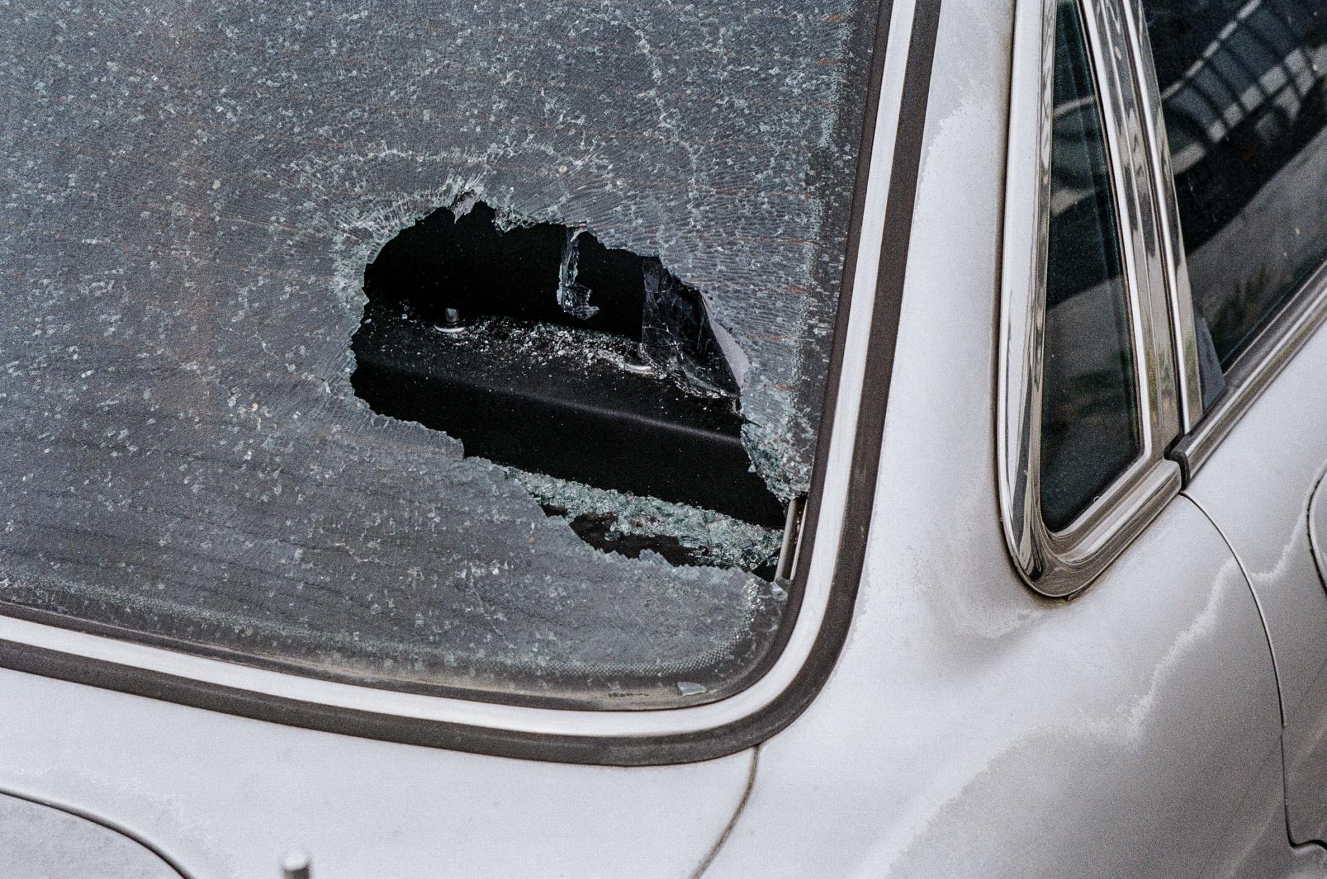 Car windshield damaged from a rock or baseball