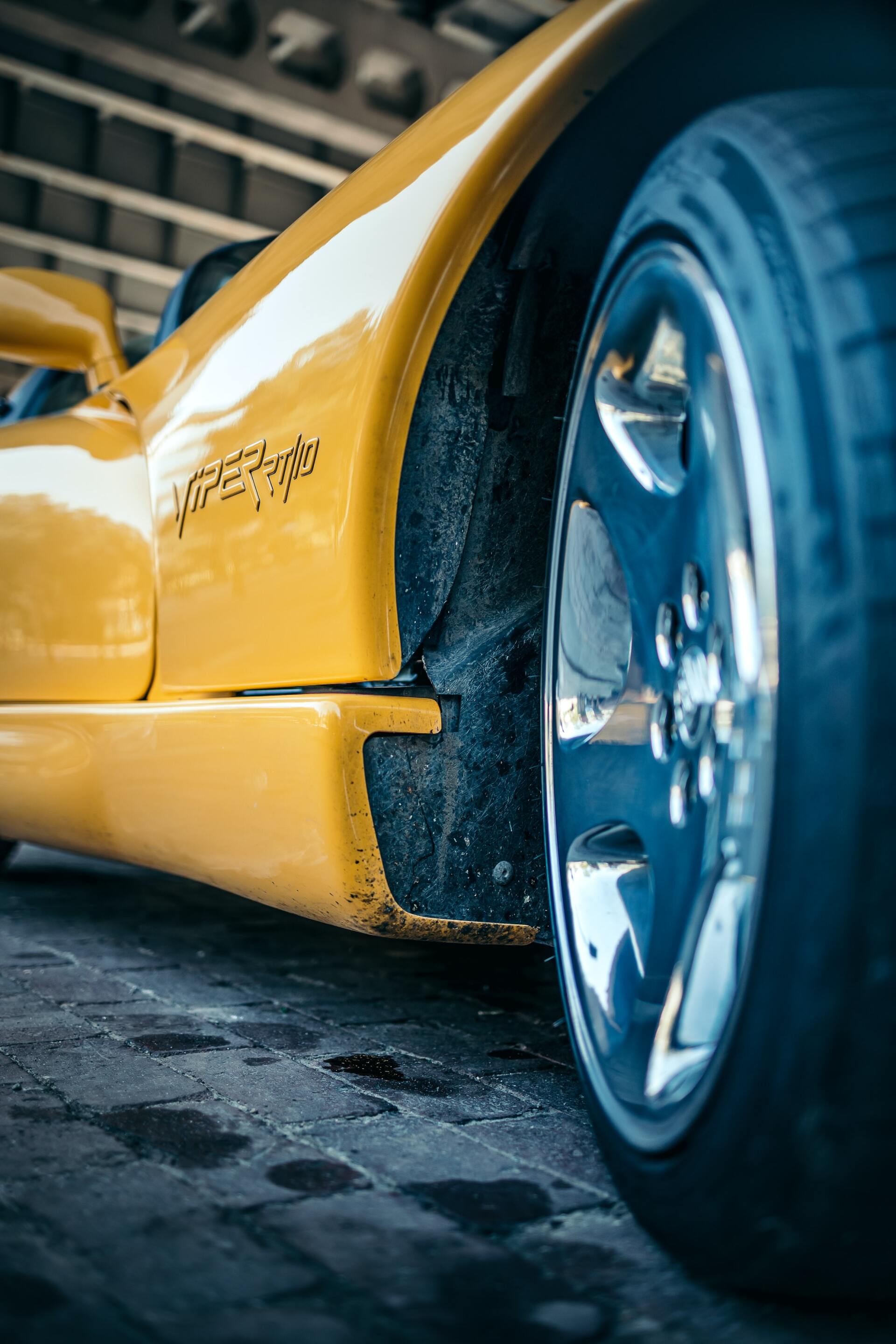 yellow Dodge Viper wheel well close up