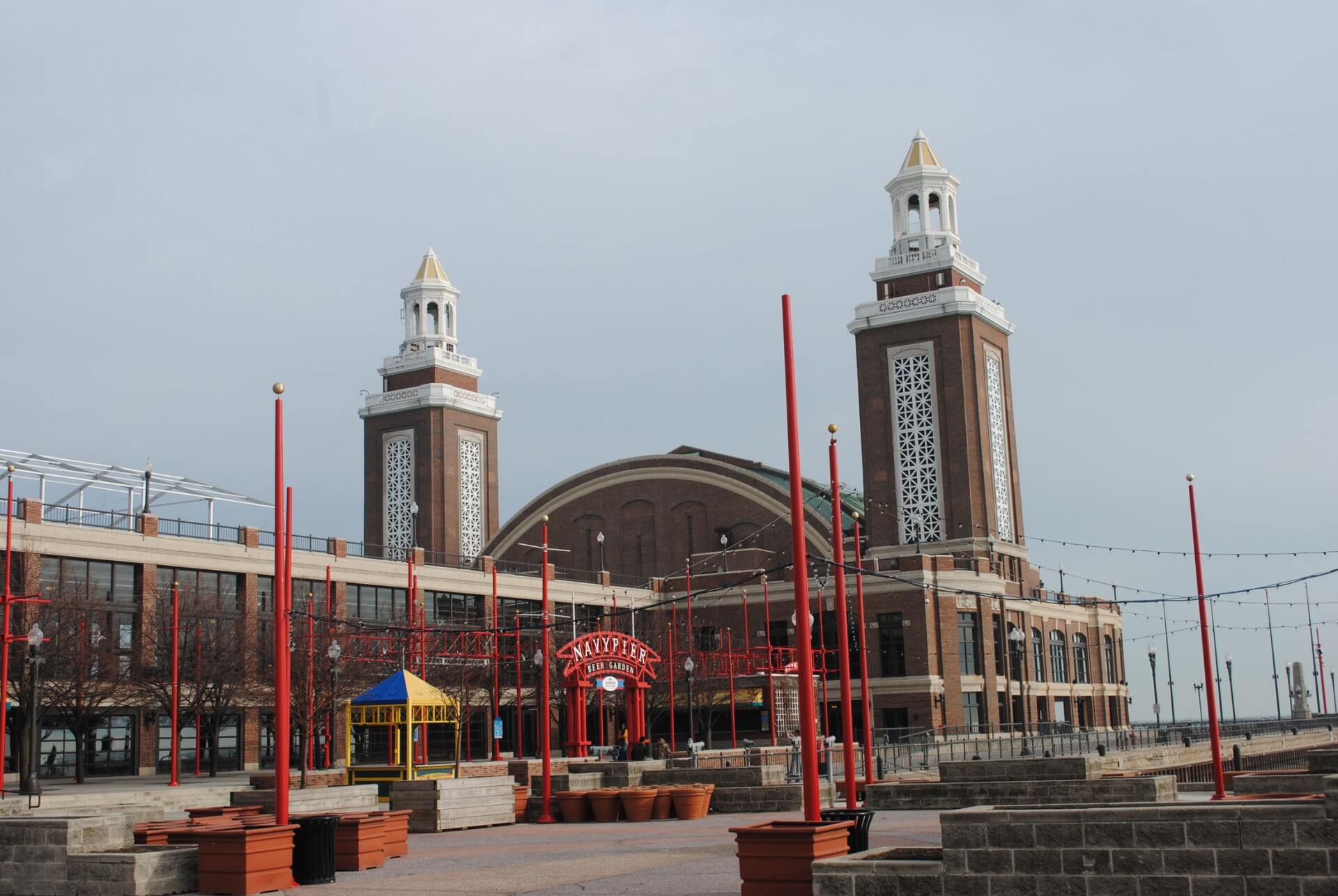 A large building with two clock towers in front of it