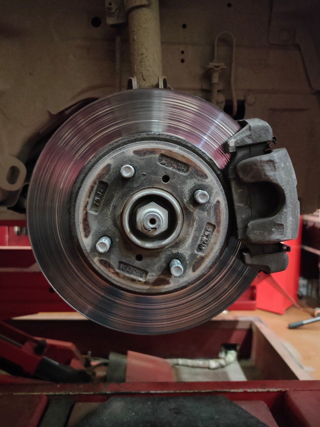A close up of a brake disc on a car.