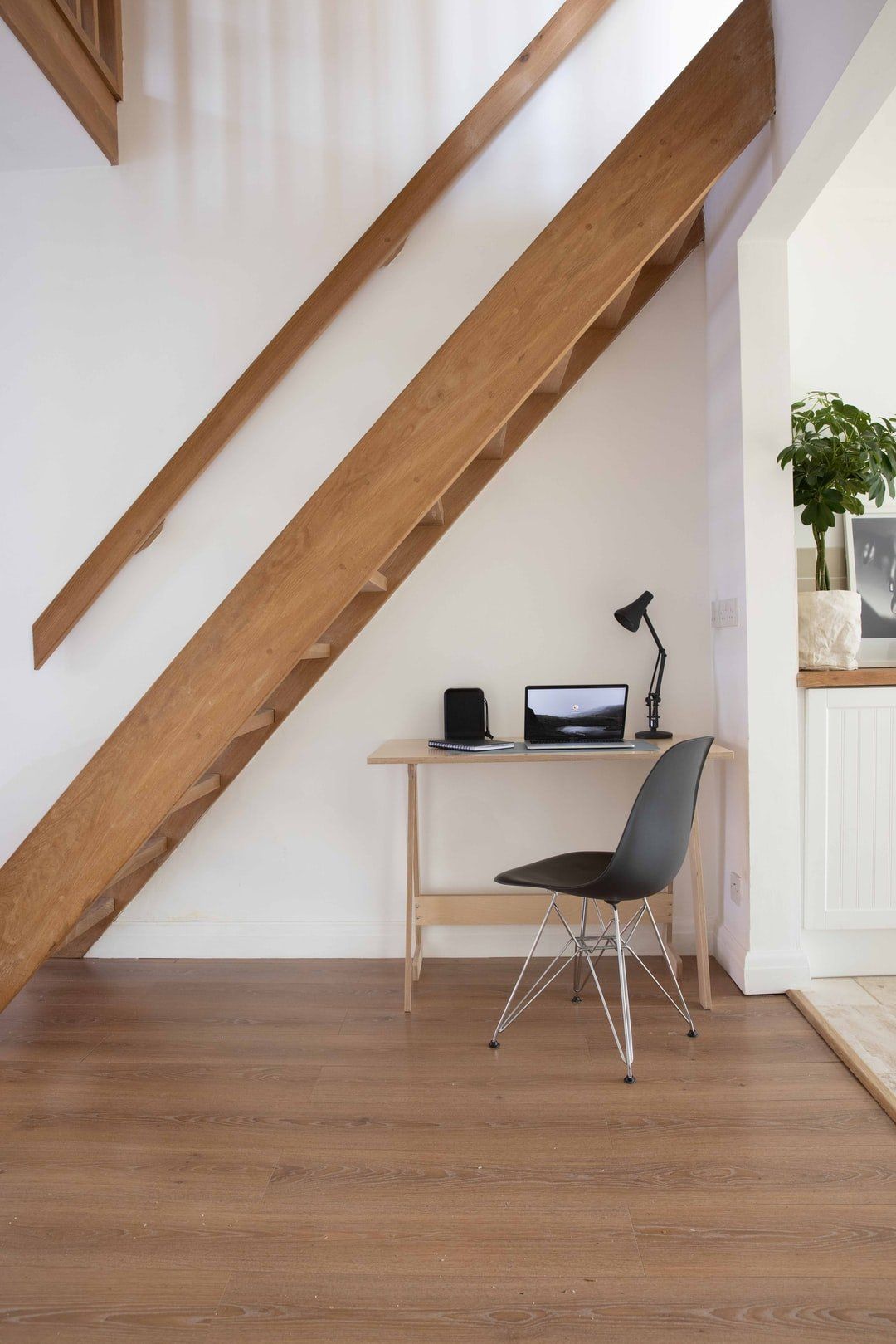 Simple pine effect home office under stairs
