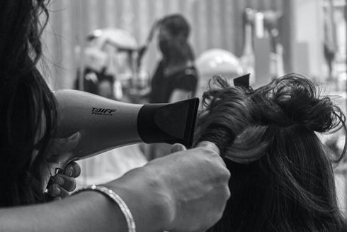 woman having hair styled