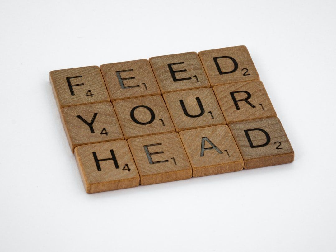 A scrabble board with the words feed your head written on it