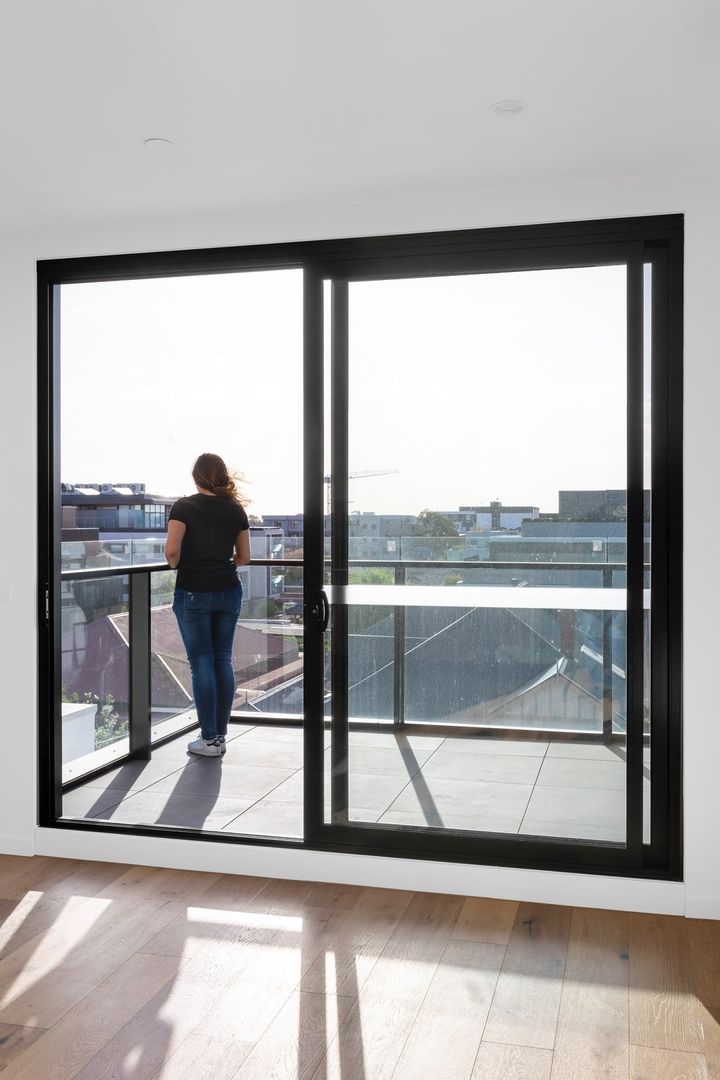 Living Room With Sliding Glass Door To Balcony — Slide EZ Doors in Invermay, TAS