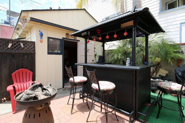 Vacation home with bikes, tiki bar and jacuzzi.